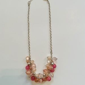 Silver toned necklace with pink beads